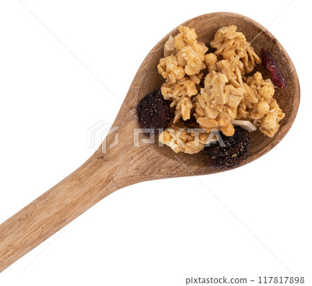 crunchy granola in wooden spoon isolated on white background crunchy granola in wooden spoon isolated on white background 117817898