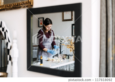 Creating stunning epoxy resin art in a cozy studio during an afternoon DIY session Creating stunning epoxy resin art in a cozy studio during an afternoon DIY session 117818092