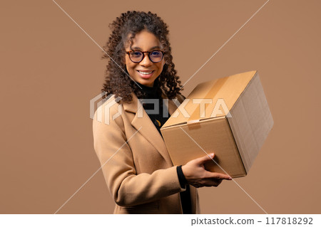 Excited smiling woman, online shopping consumer received cardboard order parcel box, desired purchase. Home courier delivery service. Sale, discounts Excited smiling woman, online shopping consumer received cardboard order parcel box, desired purchase. Home courier delivery service. Sale, discounts 117818292