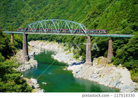 2700 Series Limited Express Nanpu train running through the beautiful green Oboke Gorge 117818330