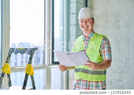 Portrait of male industrial worker in vest helmet with engineering documents 117818345