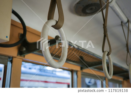 Hanging straps in an old train Hanging straps in an old train 117819138