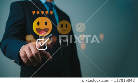 Businessman give excellent five-star ratings, Customer experience concept. Customers give excellent five-star ratings with smiley face emoticons for service, Satisfaction, Reviews, Feedback. 117819848
