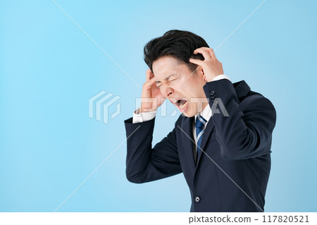 Worried businessman, sideways Worried businessman, sideways 117820521