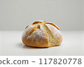 Picture of a freshly baked rustic artisan bread loaf with golden crust, isolated white background 117820778