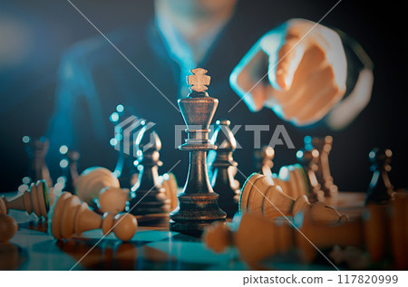Businessman planning strategy with chess figures 117820999