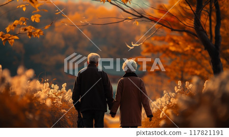 Elderly couple walking together in a fall setting 117821191