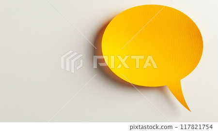 Artistic shot of a yellow paper speech bubble centered on a plain white background, with slight texture and soft shadow Artistic shot of a yellow paper speech bubble centered on a plain white background, with slight texture and soft shadow 117821754