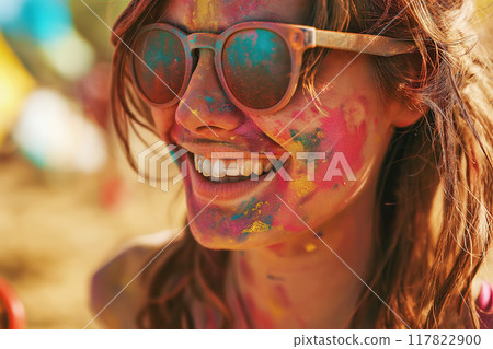 Happy young woman having fun in crowd at Holi festival of colors, summer party or music festival 117822900
