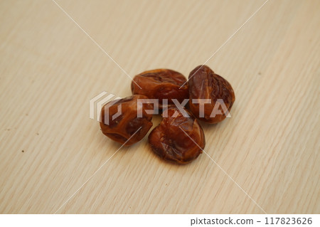 Fresh dates on a wooden background 117823626