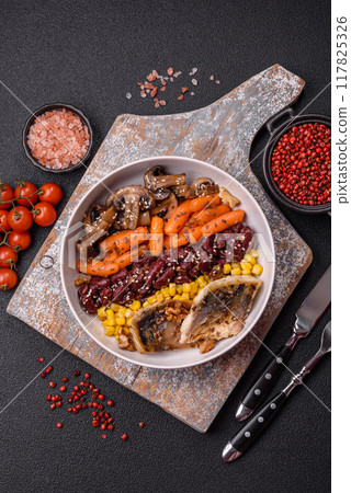 A colorful vegetarian dish consists of fish, beans, corn, mushrooms A colorful vegetarian dish consists of fish, beans, corn, mushrooms 117825326