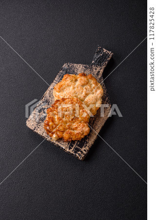 Delicious fried pork or chicken chops breaded with salt and spices 117825428
