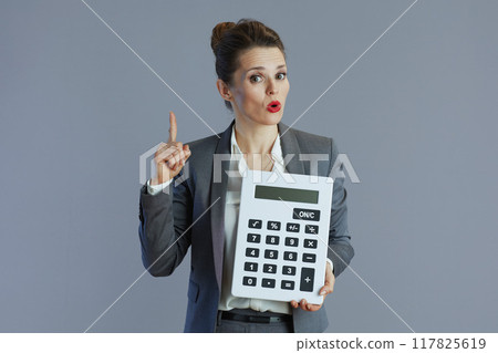 surprised elegant woman employee isolated on gray background surprised elegant woman employee isolated on gray background 117825619