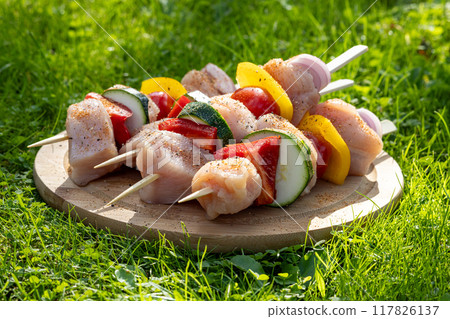raw chicken and vegetable skewers 117826137