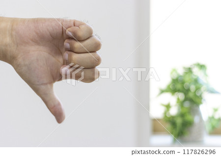 A man's hand giving a thumbs down (30s, Japanese) 117826296