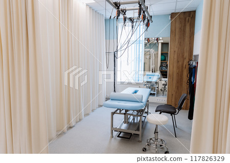 Modern rehabilitation and physical therapy room with equipment for effective patient recovery 117826329