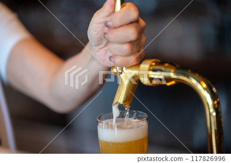 The moment of pouring beer 117826996