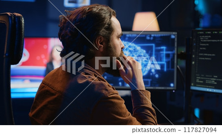 Computer scientist writes code on PC to visualize artificial intelligence neural networks. Remote IT worker runs AI script for information processing from personal office, camera A Computer scientist writes code on PC to visualize artificial intelligence neural networks. Remote IT worker runs AI script for information processing from personal office, camera A 117827094