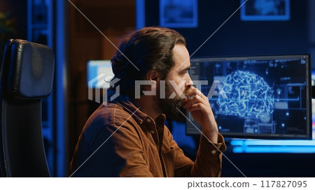 Programmer using computer to update artificial intelligence neural networks, drinking coffee and writing code scripts in home office. IT admin enjoying hot beverage while programming AI, camera A 117827095