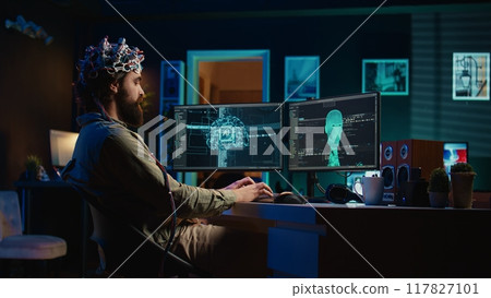 Developer with EEG headset on programming brain transfer into computer virtual world, becoming one with AI. Transhumanist using neuroscientific tech to transcend physical limitations, camera B Developer with EEG headset on programming brain transfer into computer virtual world, becoming one with AI. Transhumanist using neuroscientific tech to transcend physical limitations, camera B 117827101