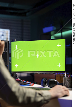 Man using isolated screen PC monitor to update artificial intelligence neural networks, writing binary code script. IT professional upgrading high tech AI using chroma key computer, close up Man using isolated screen PC monitor to update artificial intelligence neural networks, writing binary code script. IT professional upgrading high tech AI using chroma key computer, close up 117827194