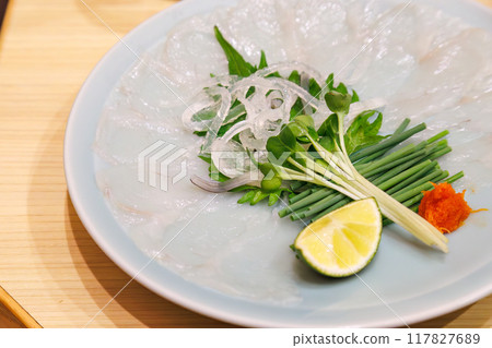 Salad of tiger pufferfish skin. A high-class pufferfish restaurant. You can taste large tiger pufferfish. April 2024 117827689