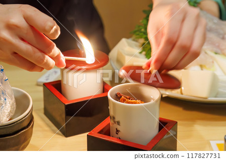 Tiger pufferfish fin sake. Add grilled pufferfish fins to hot sake. Flambé it just before drinking to evaporate the alcohol. Tiger pufferfish fin sake. Add grilled pufferfish fins to hot sake. Flambé it just before drinking to evaporate the alcohol. 117827731