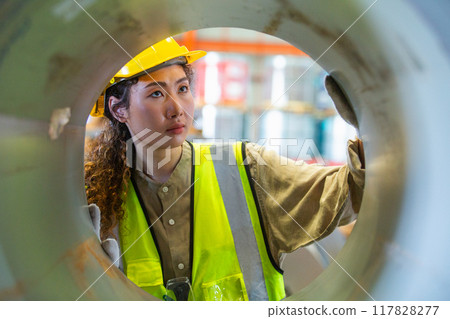 female wearing safety uniform worker checking quality product metal sheet factory. 117828277