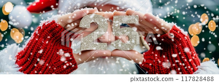 Santa claus hands holding 25 number, symbolizing new year and future concepts with hope 117828488