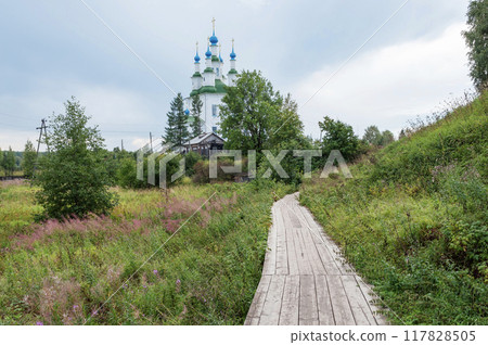 Wooden sidewalk in northern russian town Totma 117828505