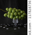 Delicious juicy Shine Muscat grapes on a glass plate 117828736