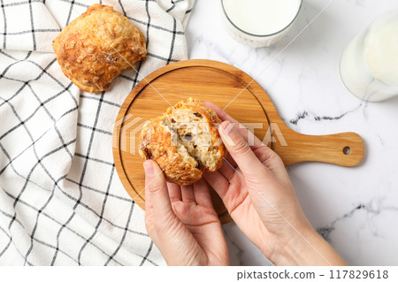 Milk with a bun on a wooden board Milk with a bun on a wooden board 117829618