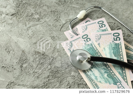 Money with medical equipment, concept of corruption in medicine. 117829676