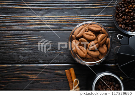 Cookies with coffee beans on a dark background Cookies with coffee beans on a dark background 117829690