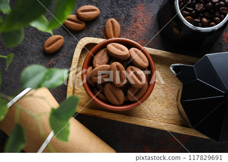 Cookies with coffee beans on a dark background Cookies with coffee beans on a dark background 117829691