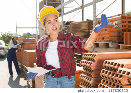 Female worker calling out for someone 117830330