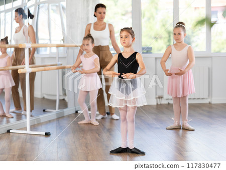Group of girls standing in first position Group of girls standing in first position 117830477