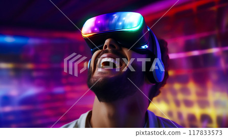 A man wearing VR goggles gets excited about virtual reality 117833573
