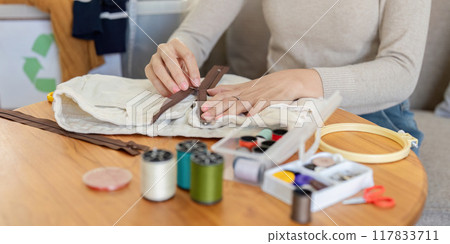 Sewing Enthusiast Fixing Zipper on Fabric. Home Crafting and Repair 117833711