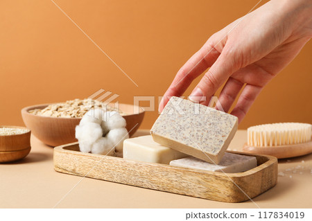 Natural handmade soap with ingredients, on a light background. 117834019