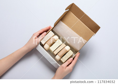 Natural handmade soap with ingredients, on a light background. 117834032