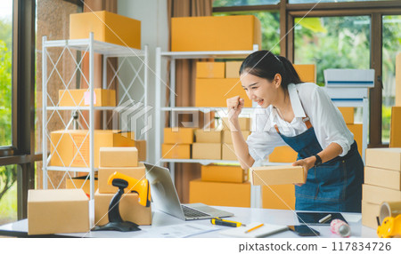 Small business owners Online Retailers rejoice and be happy with orders coming in from online customers.concept shopping online 117834726