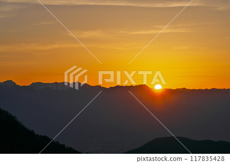 View of the sun setting over the Northern Alps from Utsukushigahara View of the sun setting over the Northern Alps from Utsukushigahara 117835428