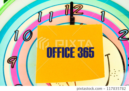 OFFICE 365 words written on the sticker on the background of the clock face with hands OFFICE 365 words written on the sticker on the background of the clock face with hands 117835782