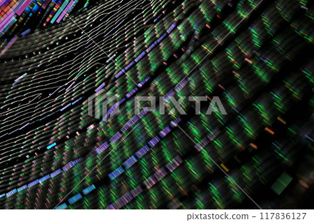 A close-up of a spider web shining iridescently in the morning sun A close-up of a spider web shining iridescently in the morning sun 117836127