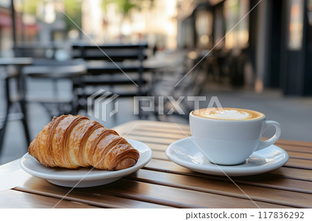 Croissant and coffee on coffee table in city coffee outside. Generative AI. 117836292