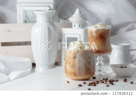 Iced coffee with cream and natural ice. 117836312