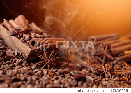 Steaming coffee beans with cinnamon sticks, anise, and nutmeg. Steaming coffee beans with cinnamon sticks, anise, and nutmeg. 117836316