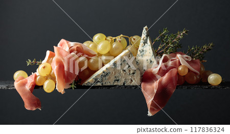 Grapes with blue cheese, prosciutto and thyme. Grapes with blue cheese, prosciutto and thyme. 117836324