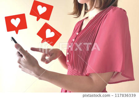 A young woman who likes a lot on her smartphone A young woman who likes a lot on her smartphone 117836339